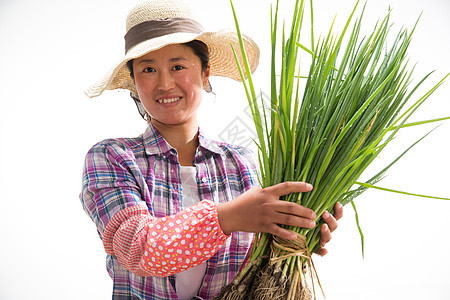 中年女人拿着一捆小葱图片