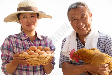 东亚农民拿着鸡和鸡蛋图片