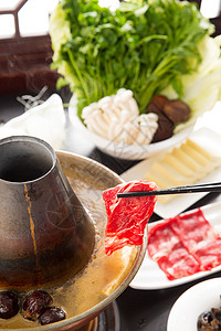 铜锅牛蛙丰盛筷子餐桌涮羊肉背景