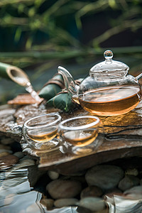 水和竹子素材中华美食粽子和一壶茶背景