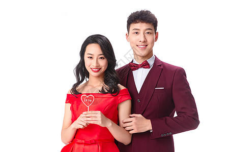 欢乐节日亚洲人浪漫情侣拿着心形棒棒糖高清图片