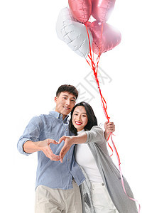亚洲约会青年伴侣浪漫情侣拿着心形气球图片