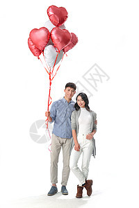 亚洲人彩色图片青年女人浪漫情侣拿着心形气球图片