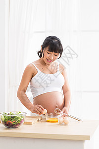 怀孕膳食自信孕妇做饭背景