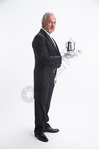 轻松摄影豪华酒店一个男侍者托着银餐具图片