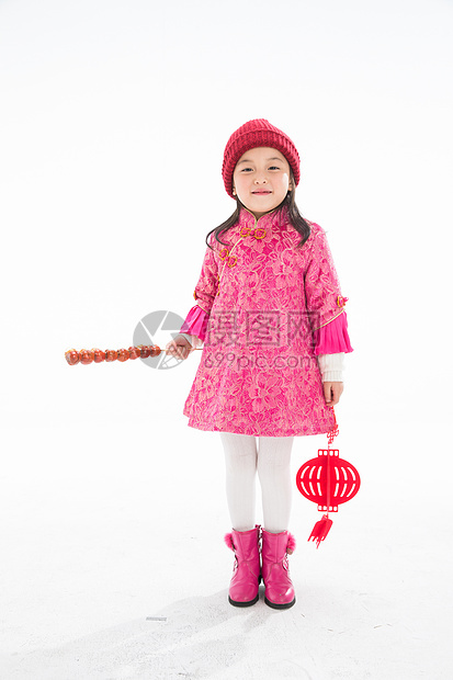 5到6岁中式衣领兴奋欢乐的小女孩吃糖葫芦图片