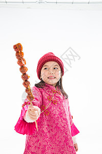 高兴的彩色图片垂直构图欢乐的小女孩吃糖葫芦图片