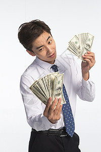美国货币理财青年人商务青年男人拿着美元图片