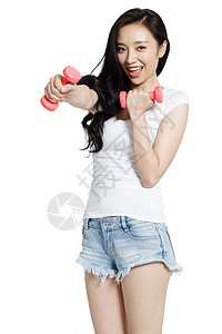 20多岁肖像东方人年轻女人拿着哑铃锻炼图片