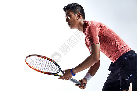 室内网球成年人运动员打网球背景