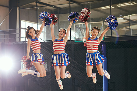 跳跃女孩啦啦队青年女啦啦队跳跃背景