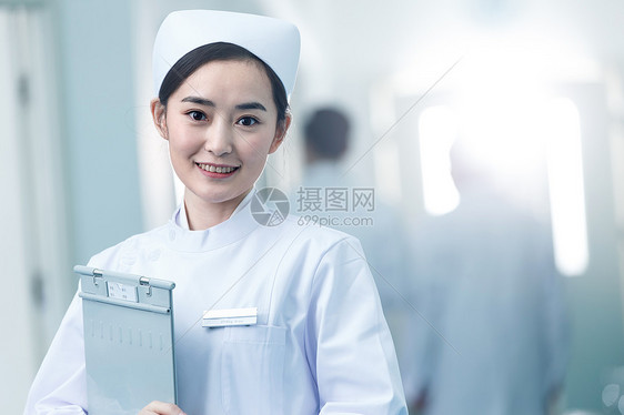 制服工作服贡献年轻的女护士在医院走廊图片