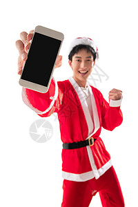 幸福微笑青年人穿圣诞服的青年男人拿着手机图片
