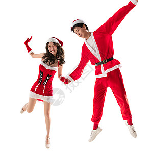 享乐漂亮的人感穿着圣诞服的快乐年轻情侣图片