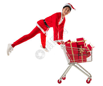 乐趣20到24岁扭头看穿圣诞服的青年男人推着购物车图片