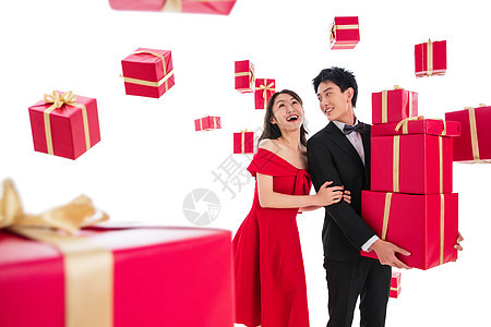 春节连衣裙20到24岁快乐的青年伴侣抱着礼品盒图片