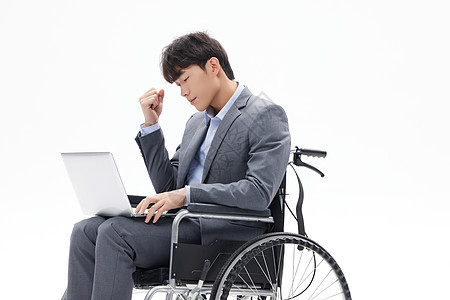 坐轮椅办公的青年白领男性图片