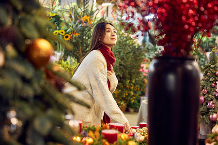 花店冬日美女集市挑选礼物背景