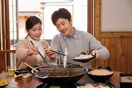 火锅食材宣传恩爱夫妻火锅店吃火锅背景