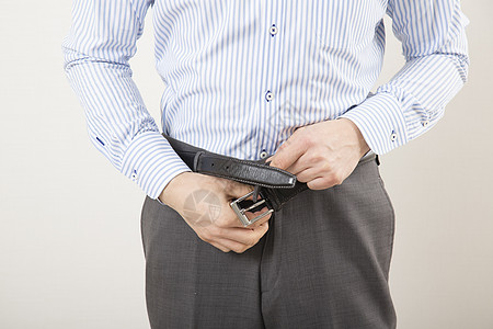 男性拉裤子拉链特写图片素材
