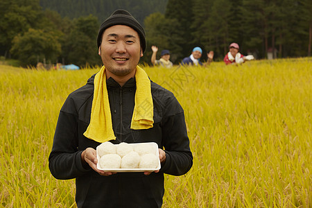 农业工作者水稻米丰收图片