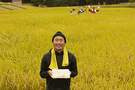 农业工作者水稻米丰收图片