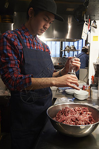 餐厅宣传单汉堡店厨师制作汉堡肉背景