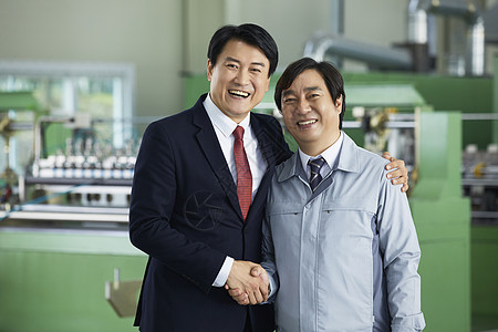 领导和厂长握手合影图片素材