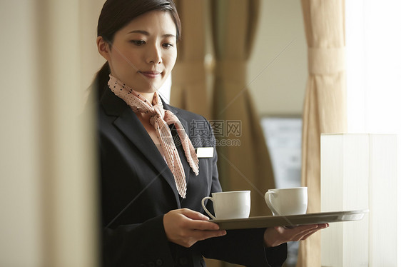 女商人仆人套装在酒店工作的女图片