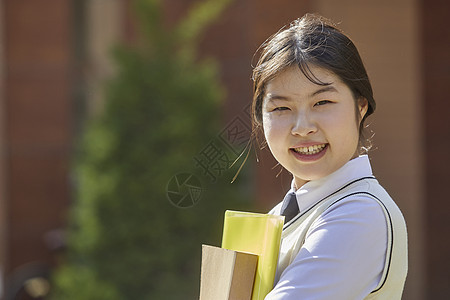 强烈的感情笔记成年女子高中生学习书本图片