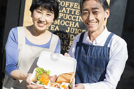 米饭商业水稻卖午餐盒食物事务的已婚夫妇图片