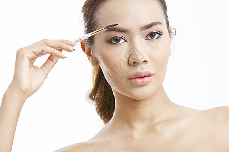 女士们刷滋润亚洲女美容系列化妆图片