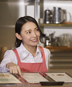 切削工具女孩美在一家咖啡馆工作的妇女图片