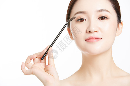 韩国民俗使用眉刷的美妆女性背景