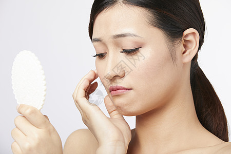 女生化妆女性护肤面部展示背景