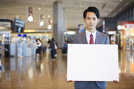 单人木板人物在海外商务旅行的一个商人消息在机场图片