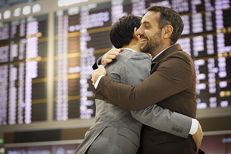 客户两个人国际一位欢迎人们到机场的商人图片