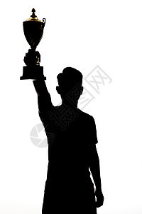 男性手举奖杯影子剪影背景图片