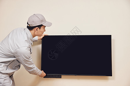 工人上门安装电视机背景图片