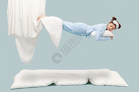 悬浮在空中的睡衣少女图片