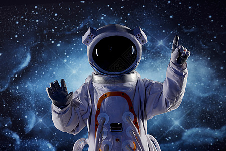 创意宇航员触碰虚拟屏幕图片