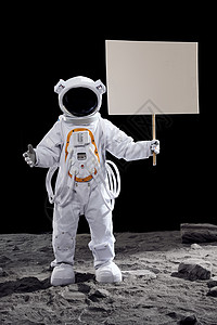 站在月亮上人站在月球表面上手拿指示牌的宇航员背景