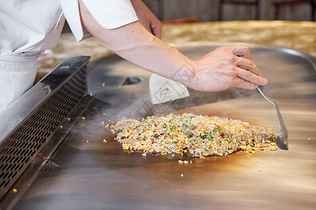 高端商务酒店厨师制作铁板炒饭背景