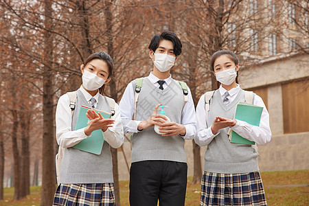 校园学生戴口罩手部消毒背景图片