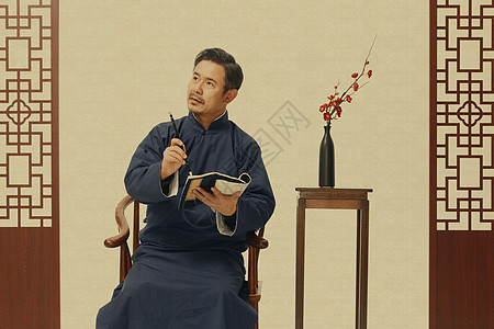 中国风长袍男性写书法背景图片