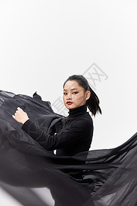 中国风女性舞者甩动裙摆背景图片