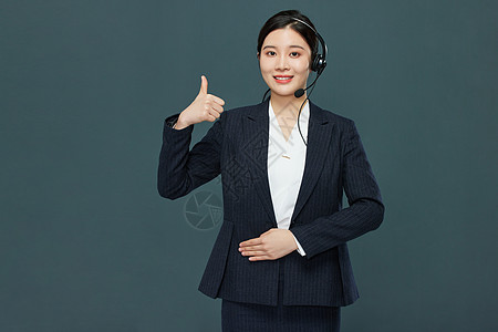 职业商务女性客服戴耳机点赞形象背景图片