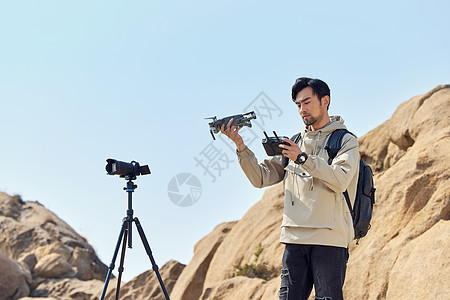 登山望远摄影师户外登山航拍摄影背景