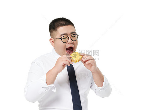 中年商务胖男士吃面包图片