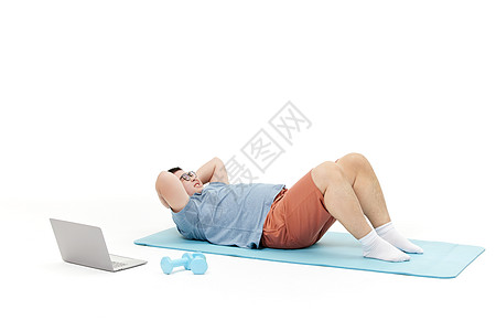 胖子男青年瑜伽垫上运动图片
